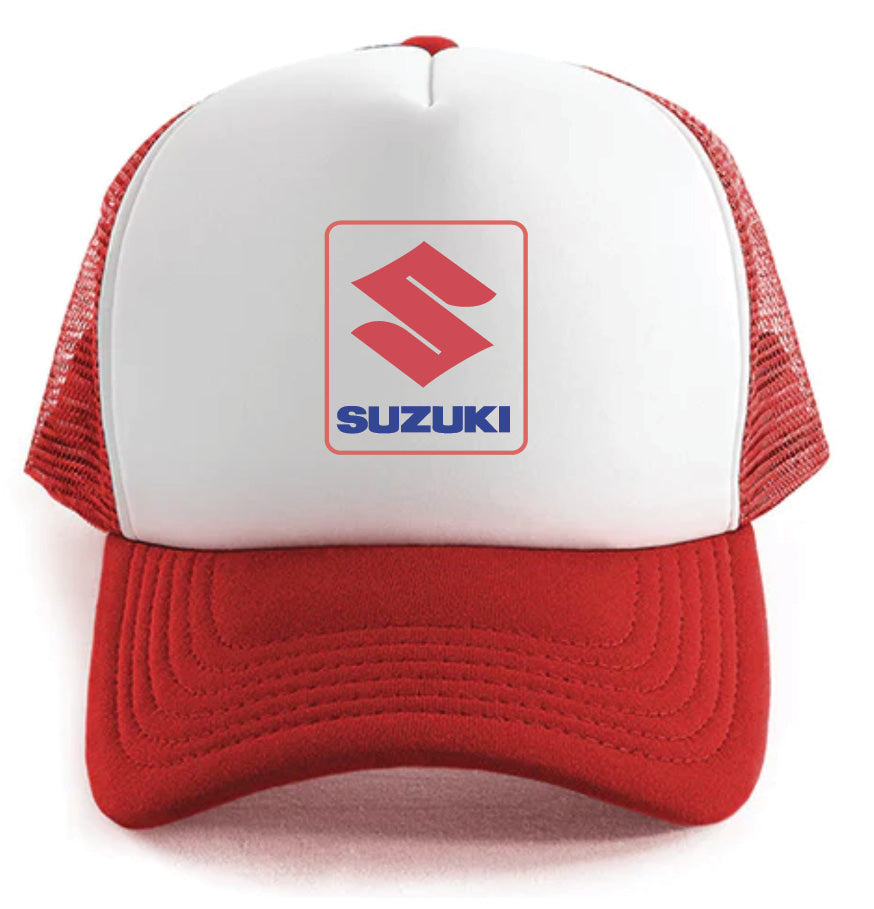 The Suzuki Hat by Corsa Clothing is a red and white trucker cap with a mesh back, showcasing the Suzuki logo and "SUZUKI" in blue on the front.
