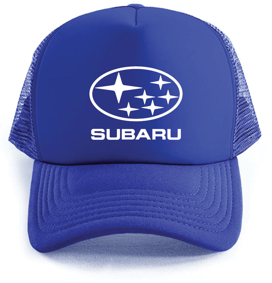 The Subaru Hat by Corsa Clothing is a blue trucker hat featuring the Subaru logo and SUBARU in white on the front, with a mesh back and curved brim.