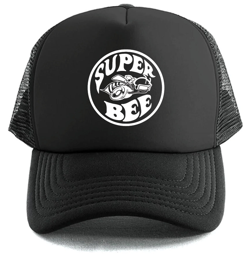 The Super Bee Hat by Corsa Clothing is a black mesh trucker hat with a round white logo featuring "SUPER BEE" and a helmeted, goggle-wearing bee riding a tire.