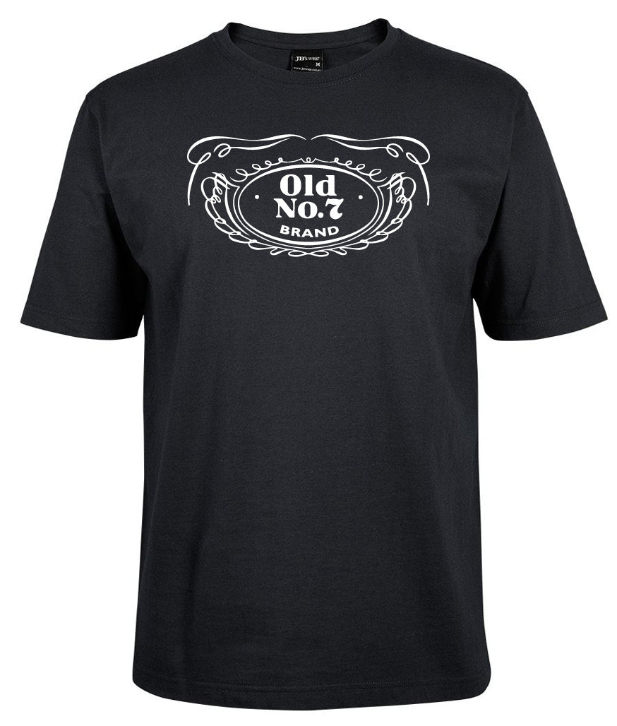 The Old NO.7 badge shirt by Corsa Clothing is a black tee with a white Old No. 7 Brand chest graphic, accented by decorative swirls and a wreath border.