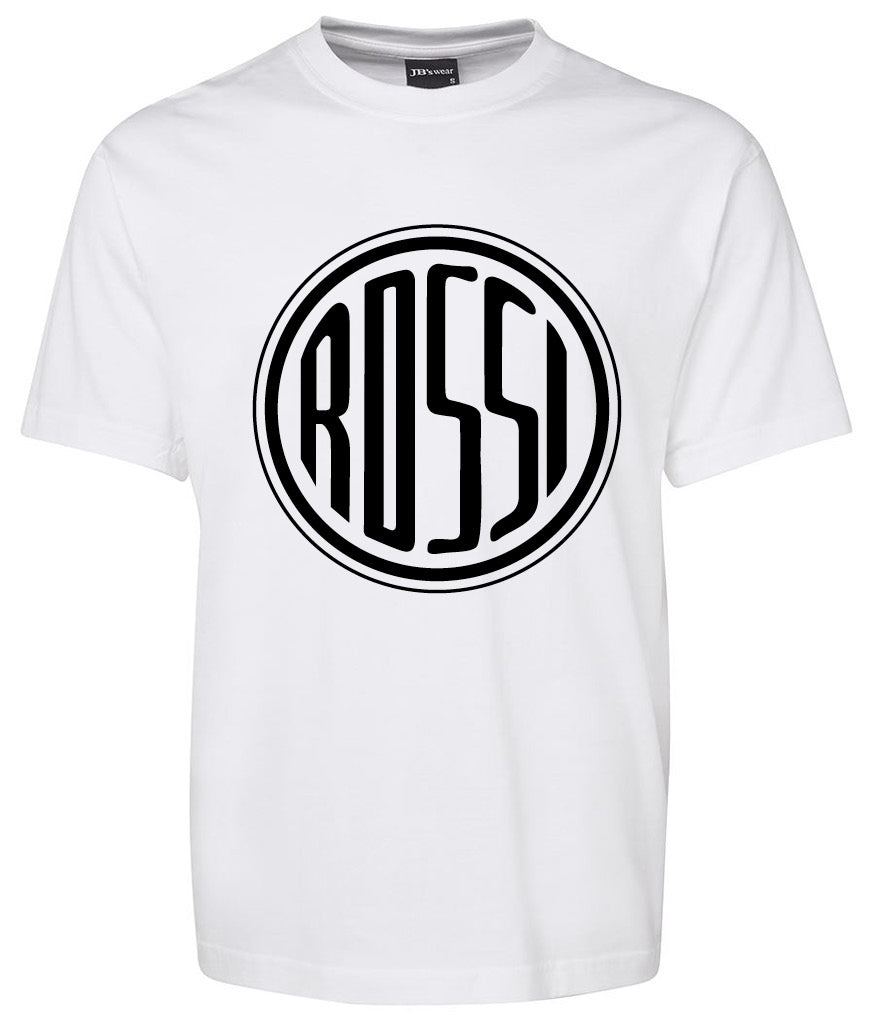 The Rossi Shirt by Corsa Clothing is a white tee with a bold black circular logo in the center, showcasing "ROSSI" in stylized, elongated capital letters.