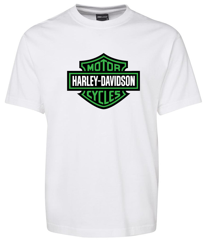 A white Corsa Clothing shirt featuring a green and black Harley-Davidson Bar & Shield logo on the chest.