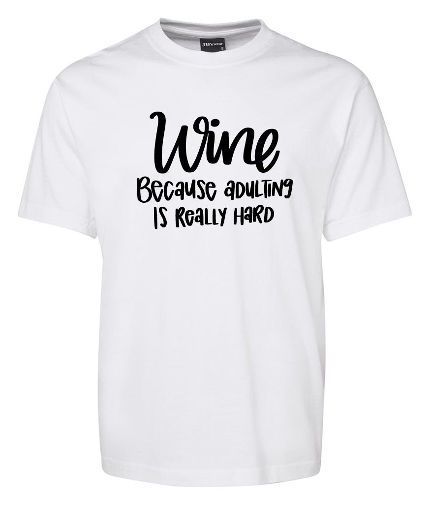 The Corsa Clothing Wine becaus adulting is reallu hard Shirt is a white tee featuring the slogan in bold black letters on the front.