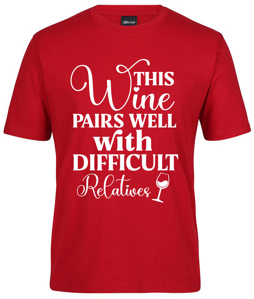 The Corsa Clothing "This wine pairs well with difficult Shirt" is a red tee with white text and a small wine glass graphic below the phrase.