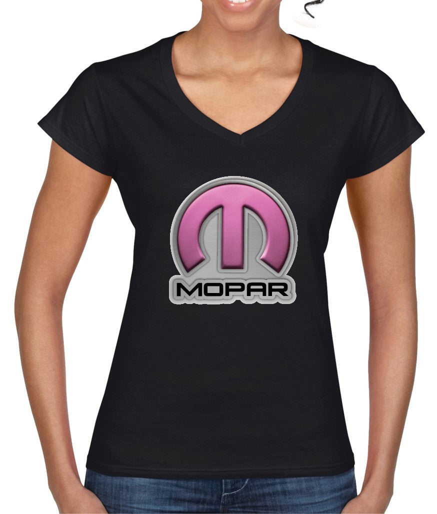A woman wearing a black t-shirt with a pink and white Mopar logo on the chest.