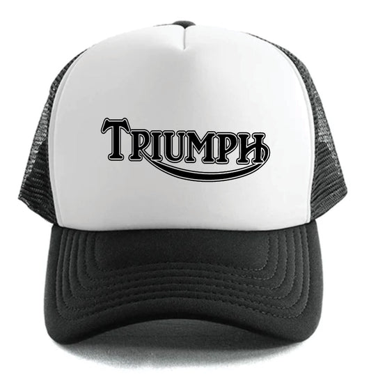 The Corsa Clothing Triumph Classic Logo Hat is a white and black trucker cap with a mesh back and "TRIUMPH" in bold, stylized black letters on the front.