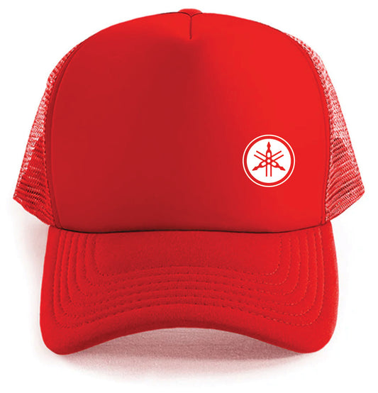 The Yamaha small Logo Hat by Corsa Clothing is a red trucker hat with a mesh back and a white circular logo of three intersecting tuning forks on the front.