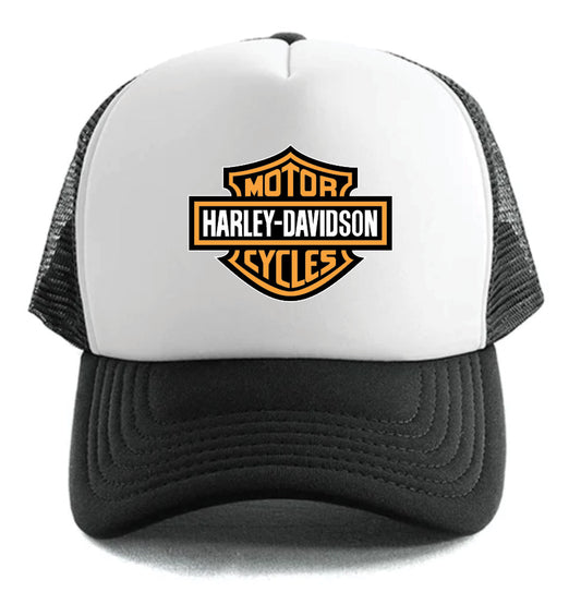 The Harley-Davidson Bar & Shield Hat by Corsa Clothing is a black and white trucker hat with an orange, black, and white Harley-Davidson Motor Cycles logo on the front panel.