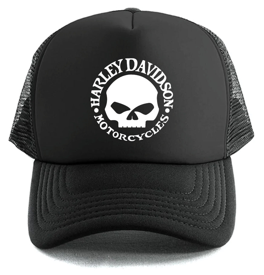 The Harley-Davidson Willie G Skull Hat by Corsa Clothing is a black mesh trucker cap with a white Harley Davidson Motorcycles logo and skull graphic on the front panel.