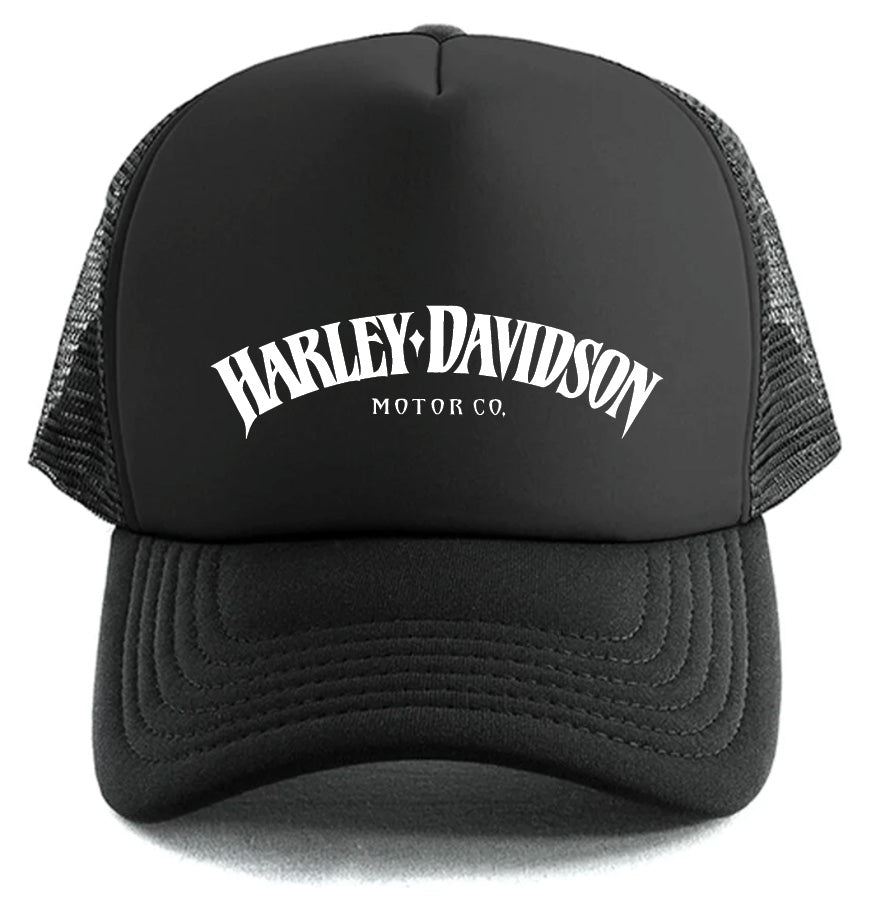 The Harley-Davidson Curved Hat by Corsa Clothing is a black mesh trucker cap featuring "Harley-Davidson Motor Co." in bold white arched letters on the front panel.