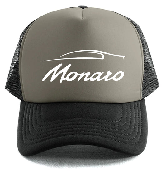 The Monaro Hat by Corsa Clothing is a two-tone trucker cap with a gray front, black mesh back, and features a white stylized car outline plus "Monaro" script on the front.