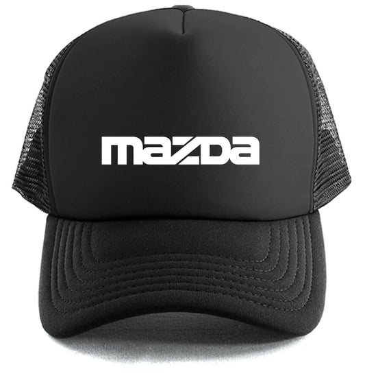 The Corsa Clothing Mazda Hat is a black trucker cap with mesh sides, showcasing the bold white Mazda logo on the front.