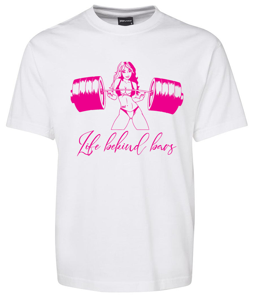 The Corsa Clothing Life Behind Bars Girl Lifting shirt features a white tee with a pink graphic of a strong woman lifting a barbell and "Life behind bars" in cursive underneath.