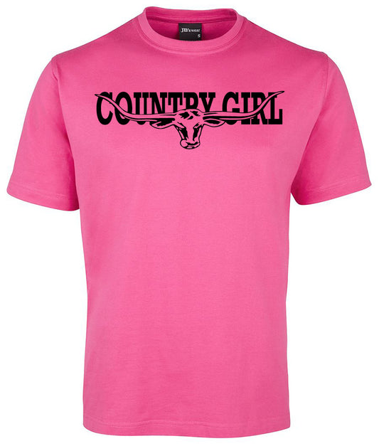 The Country Girl Cow Head Shirt by Corsa Clothing is a bright pink tee with "COUNTRY GIRL" in bold black letters and a graphic of a longhorn cow's head with large horns integrated into the text across the chest.