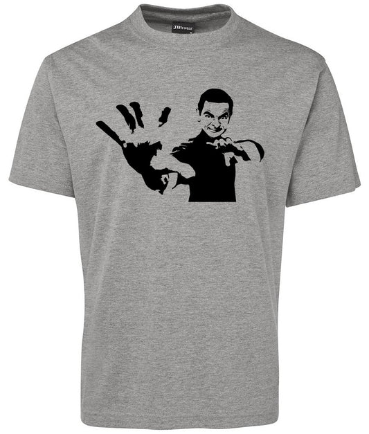 The Mr.bean shirt by Corsa Clothing is a gray tee with a black silhouette graphic of a man in a martial arts pose, featuring one arm extended forward and the other bent at the elbow.