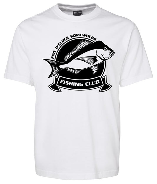The Fishing Club Shirt by Corsa Clothing is a white tee with a black fish graphic, circular emblem, “FIVE O’CLOCK SOMEWHERE” above, and “FISHING CLUB” in a ribbon banner below.
