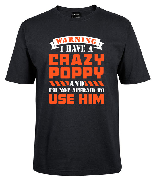 The Crazzy Poppy Shirt by Corsa Clothing is a black tee with bold white and orange text: "WARNING I HAVE A CRAZY POPPY AND I’M NOT AFRAID TO USE HIM.
