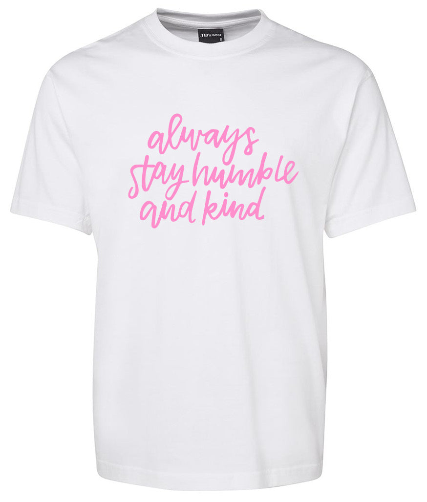 The always Stay humble and kind Shirt by Corsa Clothing features pink cursive text on the front of a plain white tee that reads, "always stay humble and kind.