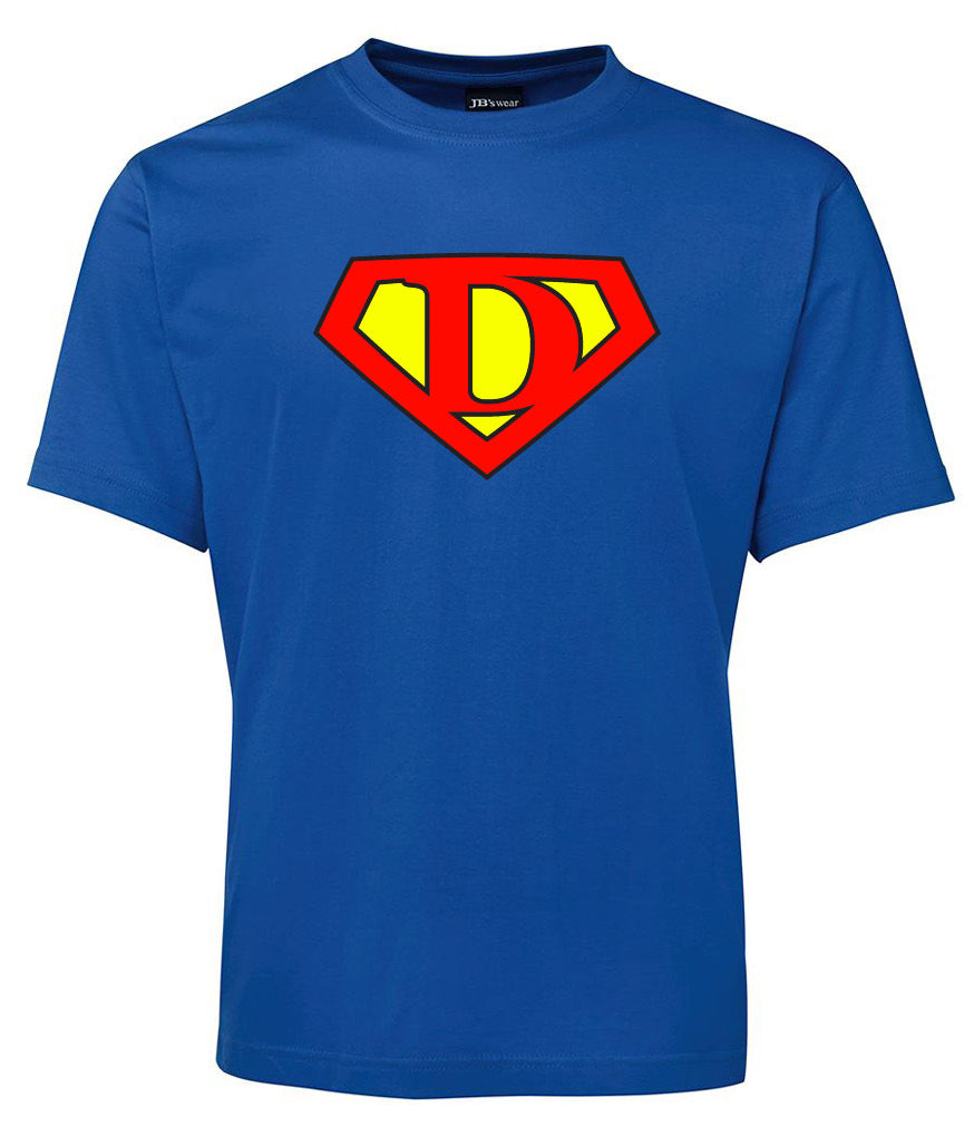The Super D Shirt by Corsa Clothing is a royal blue tee with a Superman-style red and yellow shield featuring the letter D in the center.