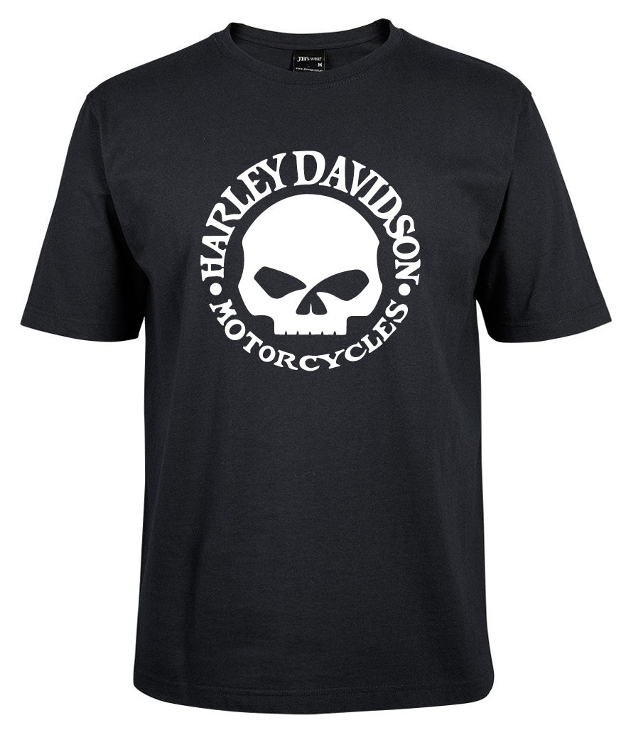 The Corsa Clothing Harley-Davidson Willie G Skull Shirt is a black T-shirt with a central white skull graphic and bold, curved "Harley Davidson Motorcycles" text encircling it.