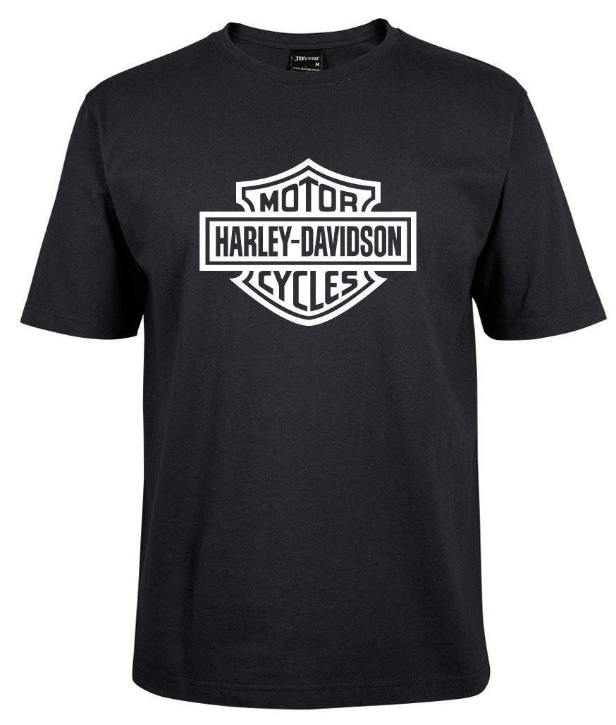 The Corsa Clothing Harley-Davidson Bar & Shield Shirt White Fill is a black crew-neck, short-sleeve t-shirt featuring the iconic white Harley-Davidson shield logo on the chest.