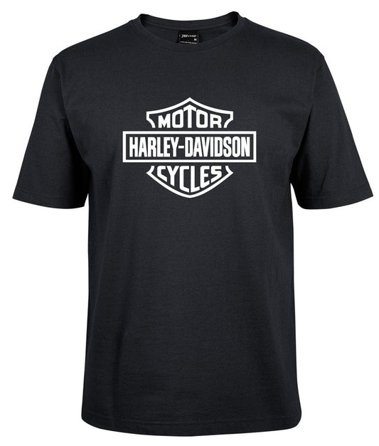The Harley-Davidson Bar & Shield Shirt White by Corsa Clothing features the iconic Harley-Davidson logo with "Motor" above and "Cycles" below the text in a shield design on the front.