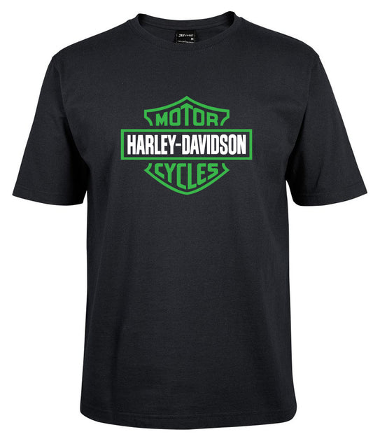 The Corsa Clothing Harley-Davidson Bar & Shield Shirt Green is a black tee with a bold green and white Harley-Davidson Motor Cycles logo and HARLEY-DAVIDSON in white text inside a green-outlined shield on the front.