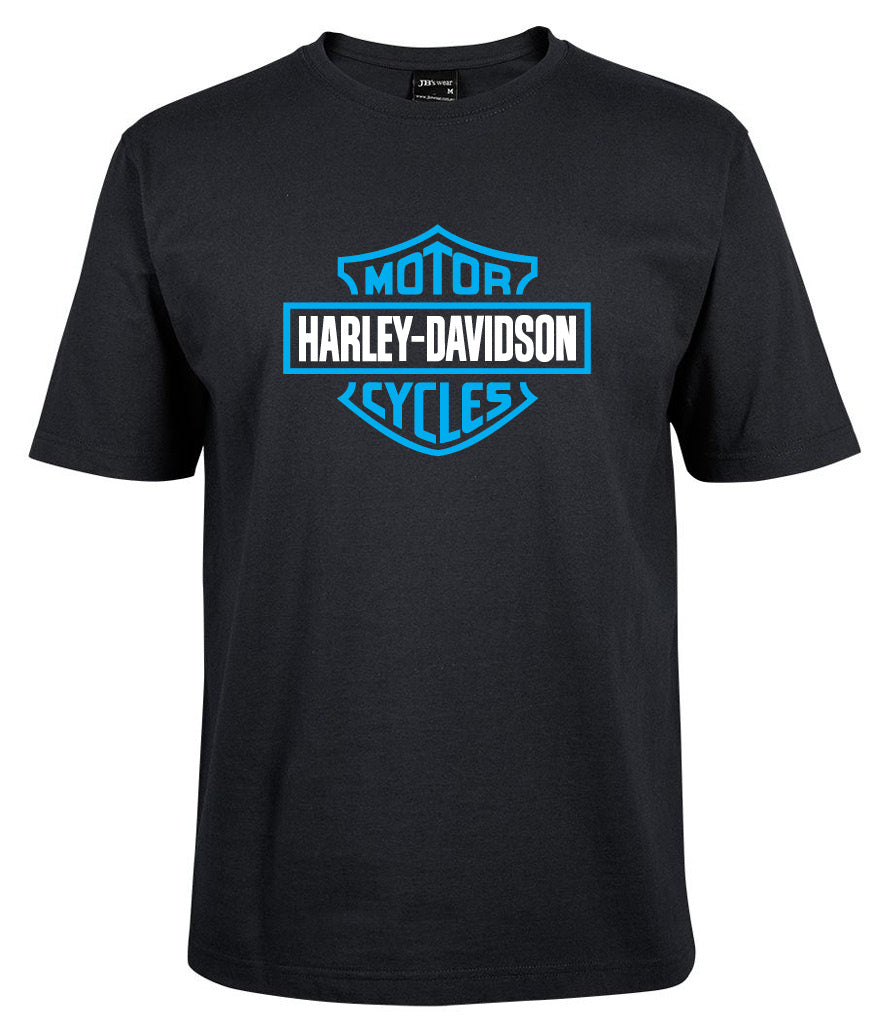 The Harley-Davidson Bar & Shield Shirt Blue by Corsa Clothing features a black tee with a blue and white, shield-shaped Harley-Davidson Motor Cycles logo boldly displayed on the front center.