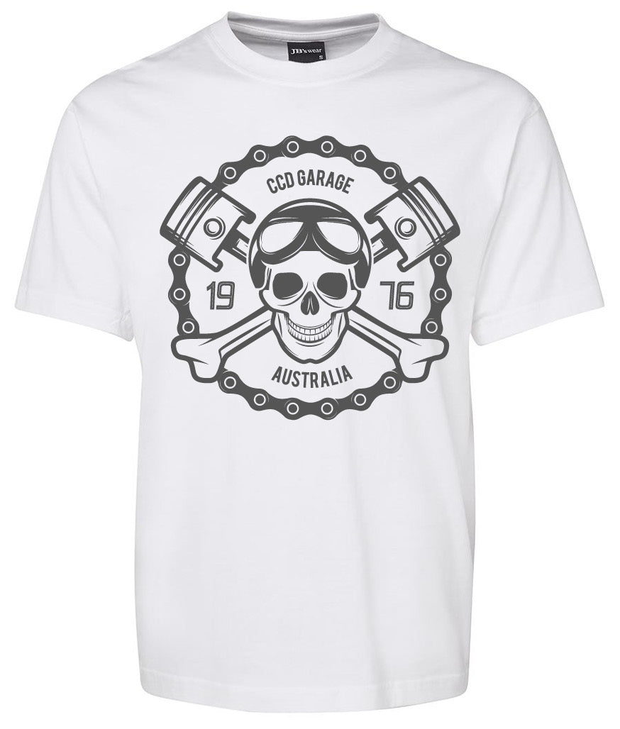 The CCD Garage Shirt by Corsa Clothing is a white tee with a bold chest graphic of a skull in goggles, crossed wrenches, two pistons, and "CCD Garage Australia 1976" text.