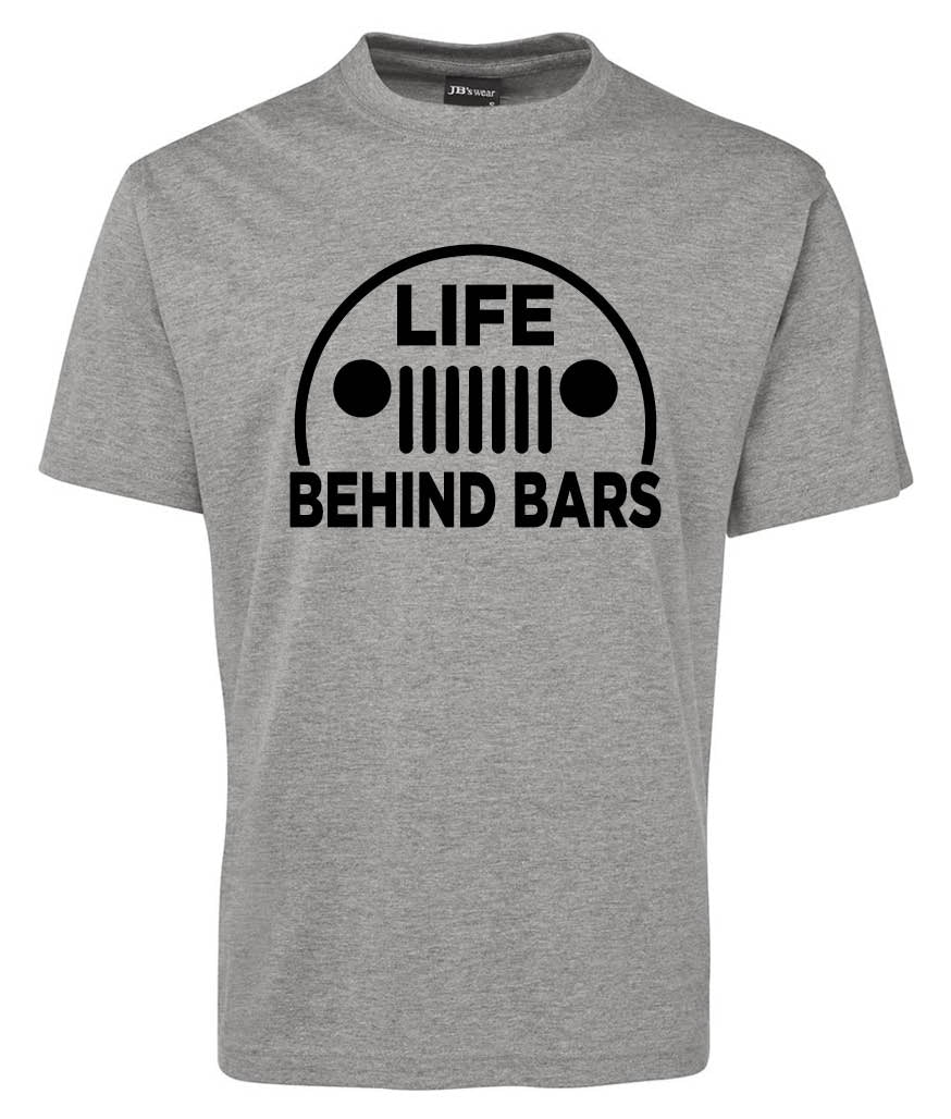 The Corsa Clothing Life Behind Bars Shirt is a gray tee featuring a black graphic of a Jeep-style grille and headlights above the bold text LIFE BEHIND BARS.