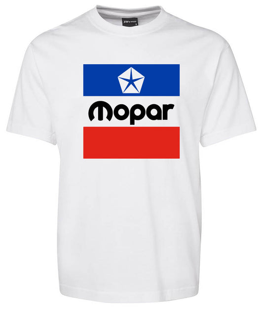 The Chrysler Mopar Classic Shirt by Corsa Clothing is a white t-shirt featuring a Mopar logo with a blue rectangle and white star outline above "Mopar" and a solid red rectangle below, centered on the chest.