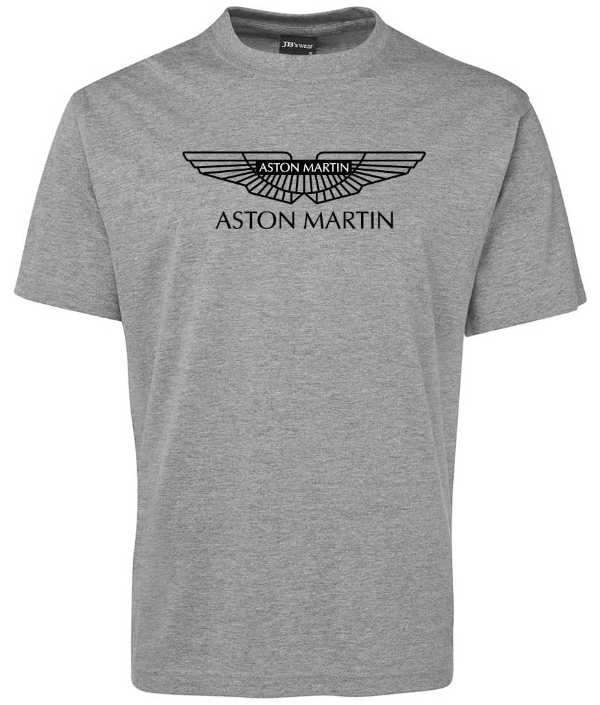 The Aston Martin Shirt by Corsa Clothing is a plain grey tee featuring the Aston Martin logo and "ASTON MARTIN" printed in black on the chest.