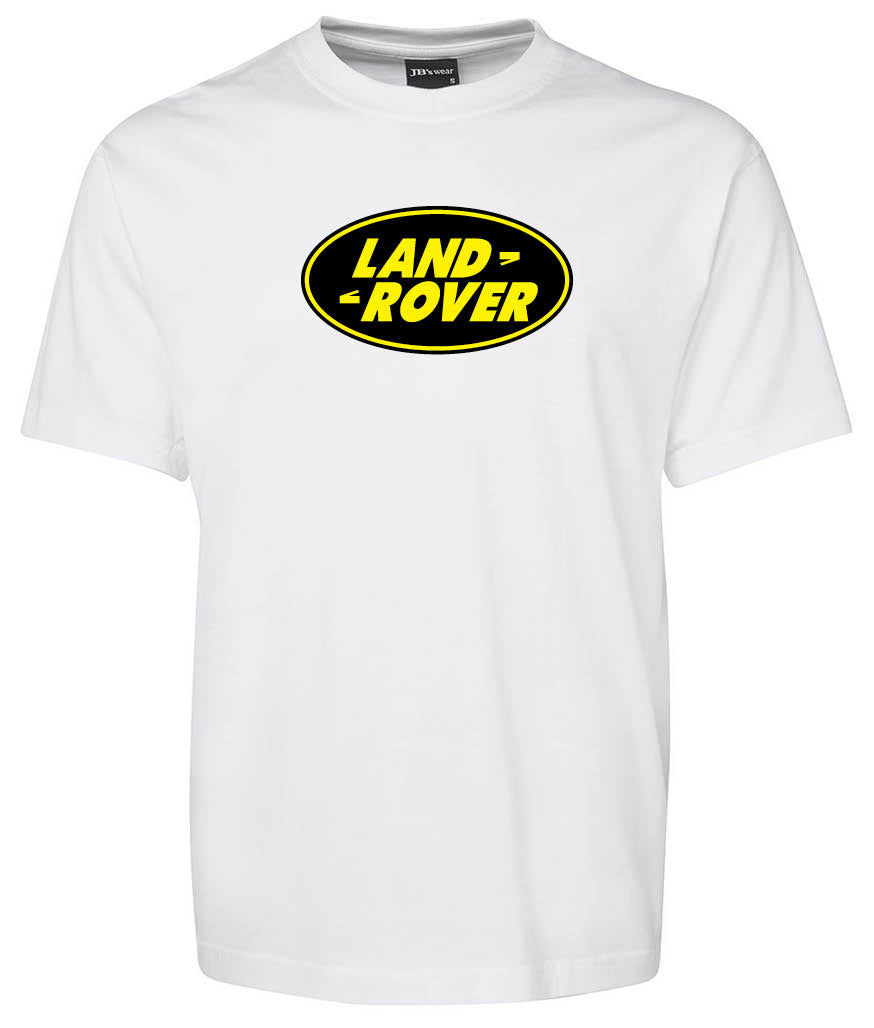 The Corsa Clothing Land Rover Shirt is a white tee with a black oval, yellow-bordered logo and bold yellow LAND ROVER lettering across the chest.