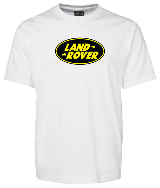 The Corsa Clothing Land Rover Shirt is a white tee with a black oval, yellow-bordered logo and bold yellow LAND ROVER lettering across the chest.