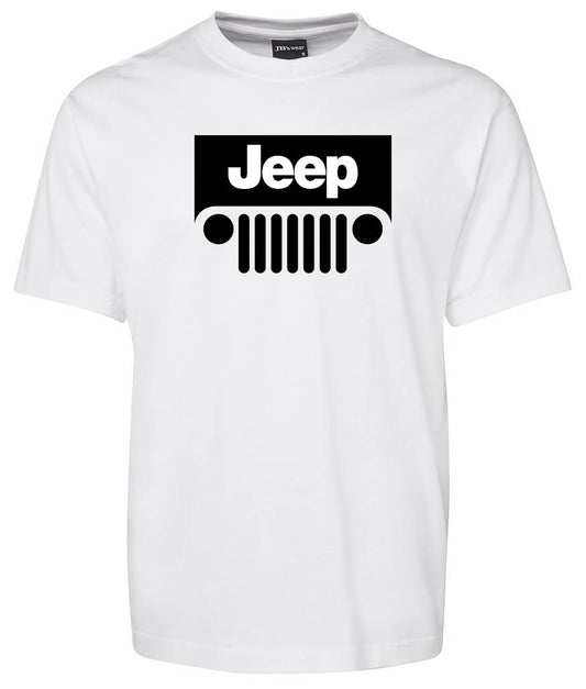 The Jeep Shirt by Corsa Clothing is a white T-shirt featuring a bold black Jeep logo with the word "Jeep" above a stylized front grille and headlights graphic on the chest.