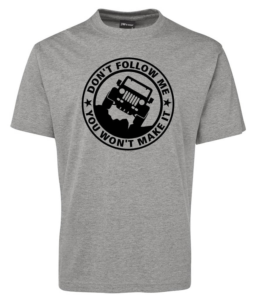 The Dont Follow Me Mark Shirt by Corsa Clothing is a gray T-shirt featuring a black circular graphic of a Jeep on rough terrain with the phrase "DONT FOLLOW ME, YOU WONT MAKE IT" surrounding it.
