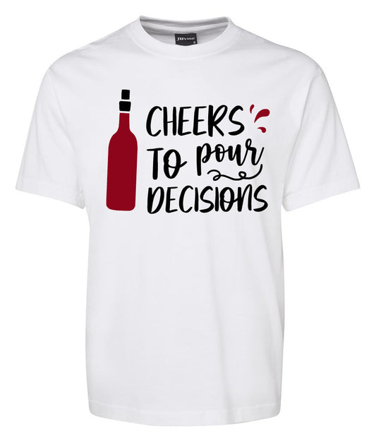 The Cheers to Pour Decisios Shirt by Corsa Clothing is a white tee with a red wine bottle graphic and the words “Cheers to pour decisions” in playful black and red lettering.