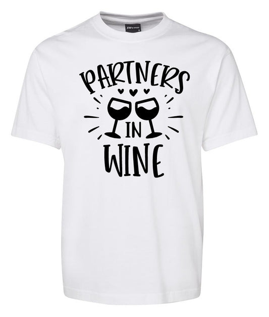 The Partners in Wine Shirt by Corsa Clothing features bold black “Partners in Wine” text and two illustrated wine glasses clinking with small hearts above them.