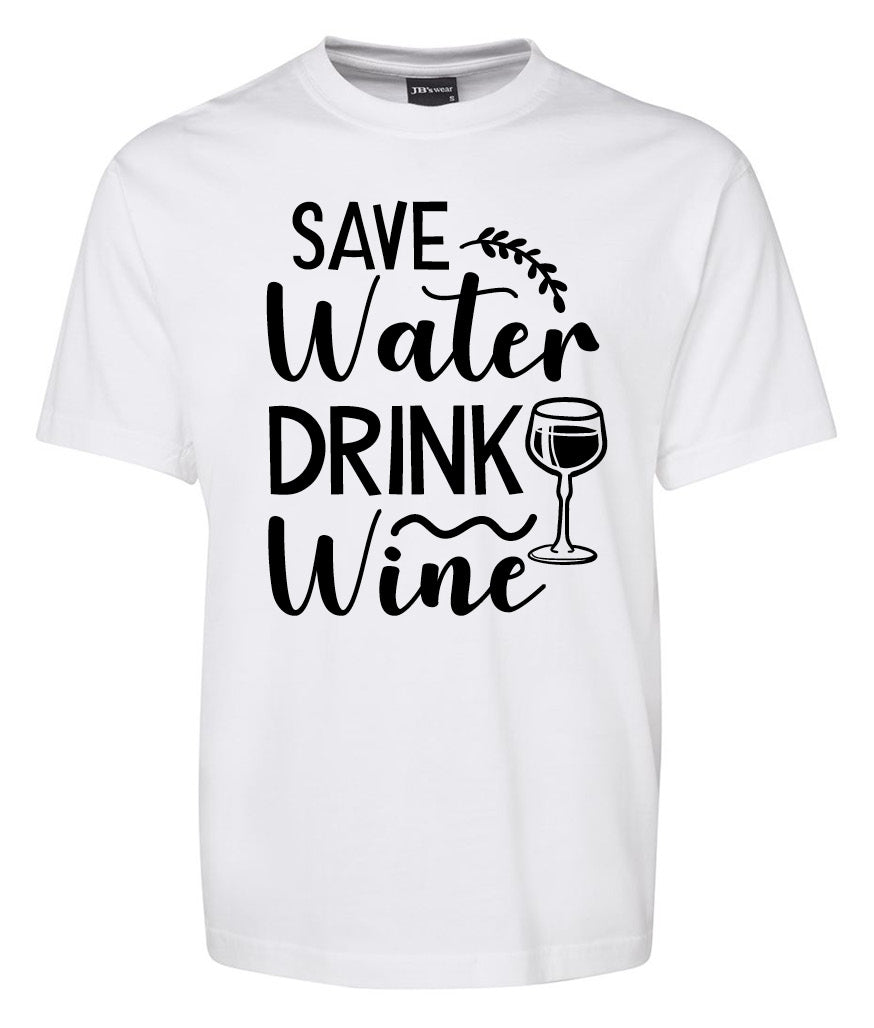 The Corsa Clothing Save Water Drink Wine Shirt is a white tee with bold black “Save Water Drink Wine” lettering, a decorative vine, and a wine glass illustration beside “Drink.”.