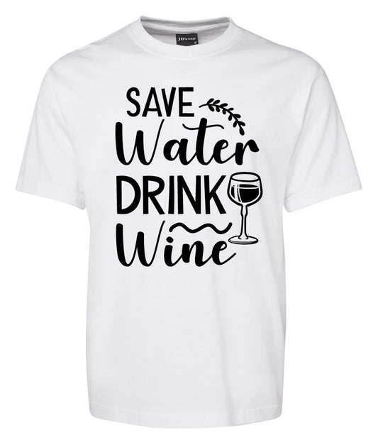 The Corsa Clothing Save Water Drink Wine Shirt is a white tee with bold black “Save Water Drink Wine” lettering, a decorative vine, and a wine glass illustration beside “Drink.”.