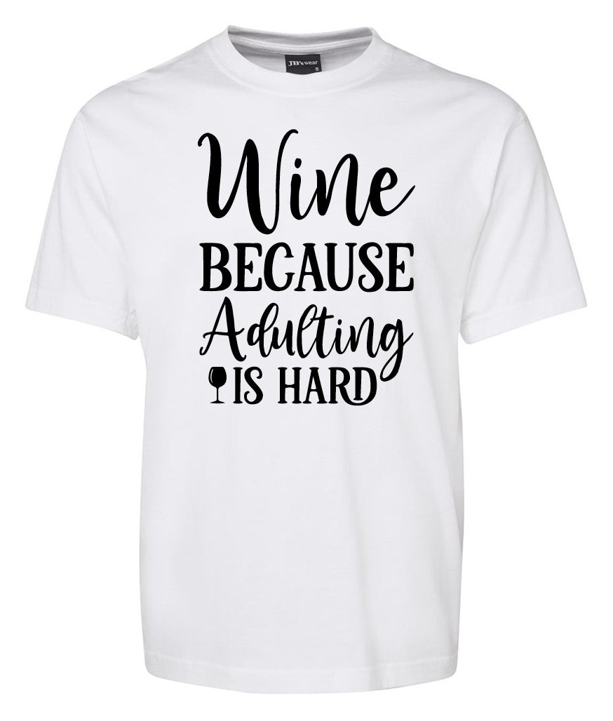 Corsa Clothing’s “Wine Because Dulting is hard” shirt features a playful design with a wine glass icon replacing the letter “I” in “wine.”.