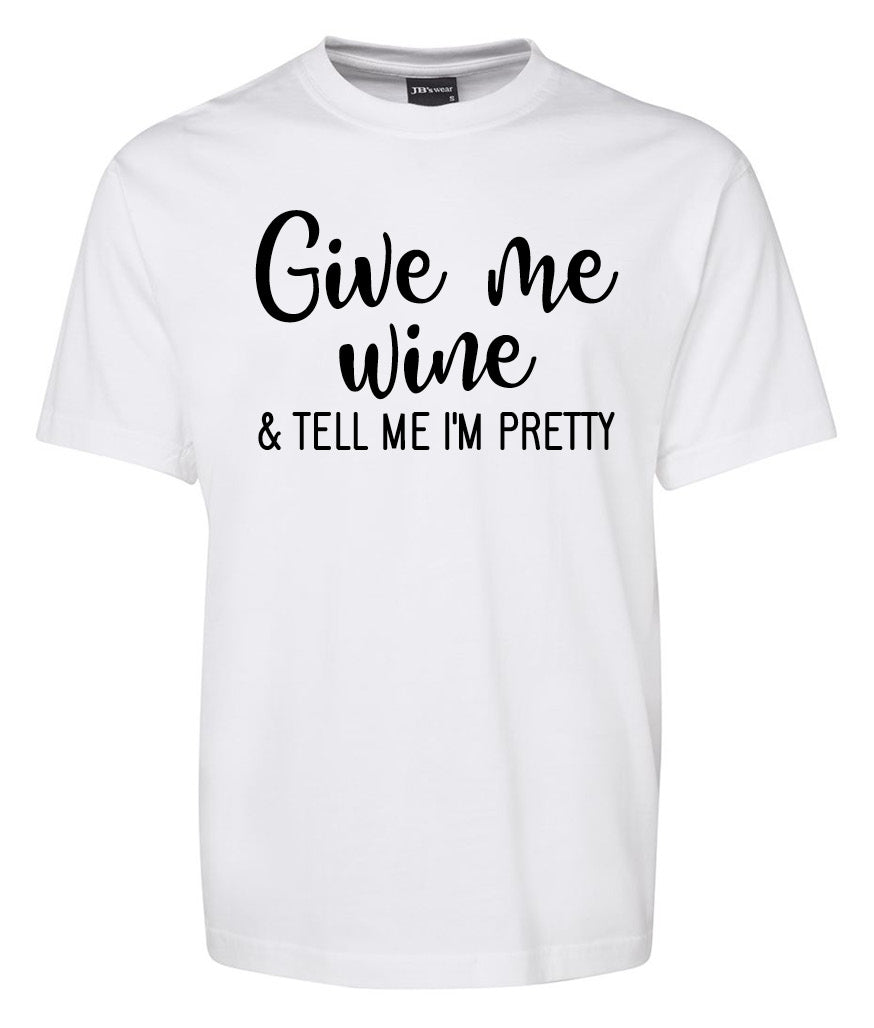 The Corsa Clothing "Give me Wine & tell me im pretty" white t-shirt features black text and is shown on a plain background.