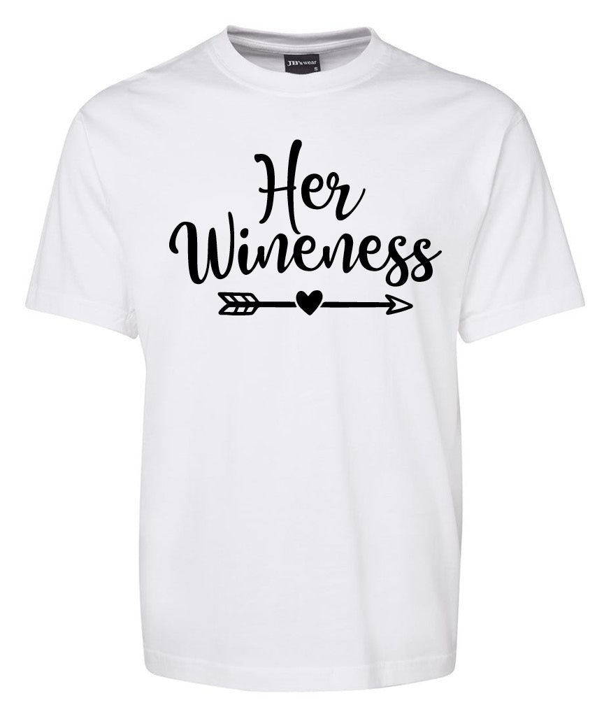The Her Wineness Shirt by Corsa Clothing is a white tee featuring “Her Wineness” in black script above a heart-tipped arrow.