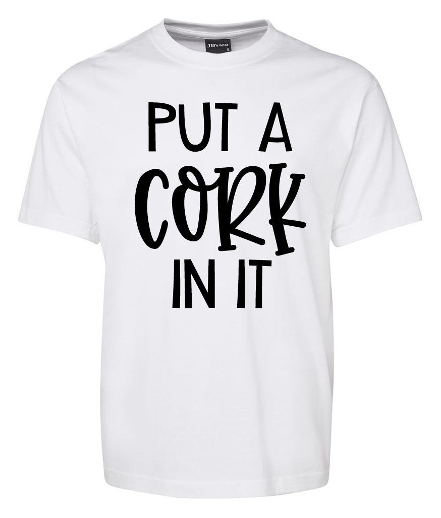 The Put a Cork in it Shirt by Corsa Clothing is a white tee featuring "PUT A CORK IN IT" boldly printed in black letters on the front.