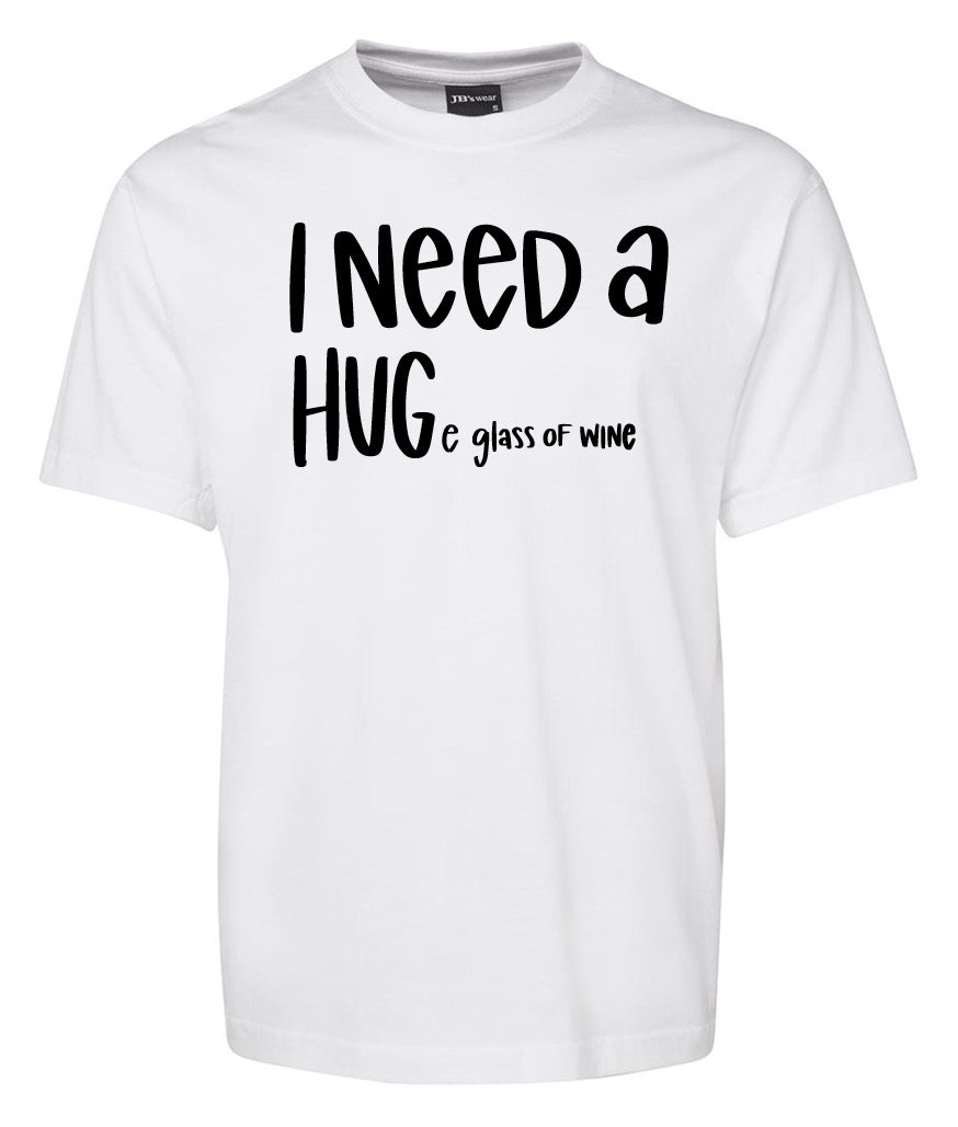 Corsa Clothing's "I need a Huge glass of Wine Shirt" is a white tee with black text featuring the word "HUG" in large letters, playfully merging a hug with a huge glass of wine for a fun, witty look.