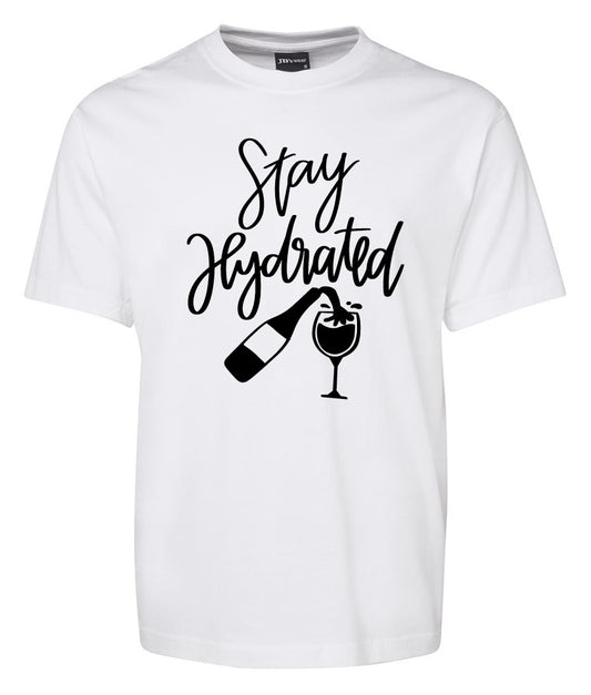 The Stay Hydrated Shirt by Corsa Clothing is a white tee featuring "Stay Hydrated" in black script with a graphic of a wine bottle pouring into a wine glass.