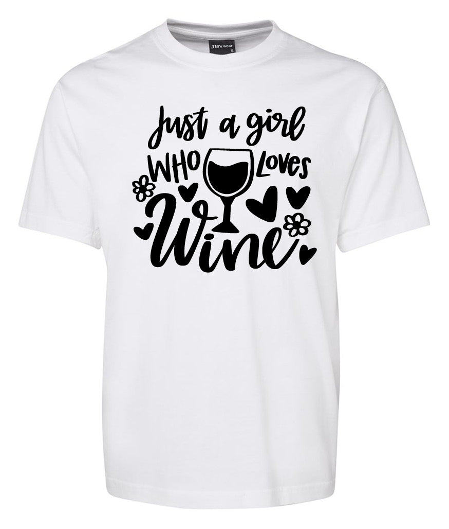 The Corsa Clothing "Just a Gril Who Loves Wine Shirt" is a white tee with black text, a wine glass, hearts, and flower illustrations.