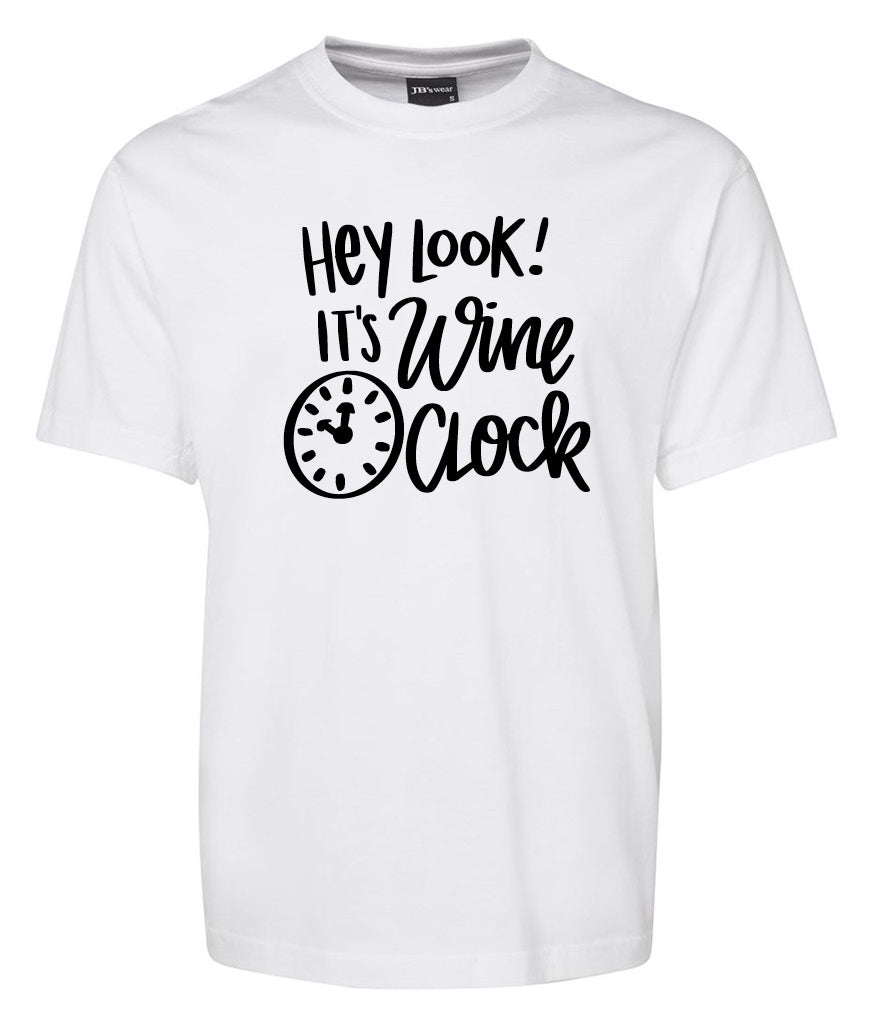 The Corsa Clothing Hey Loot It’s Wine Clock Shirt is a white tee with black text—"Hey look! It’s wine o’clock"—and a small clock graphic set to 5 o’clock.