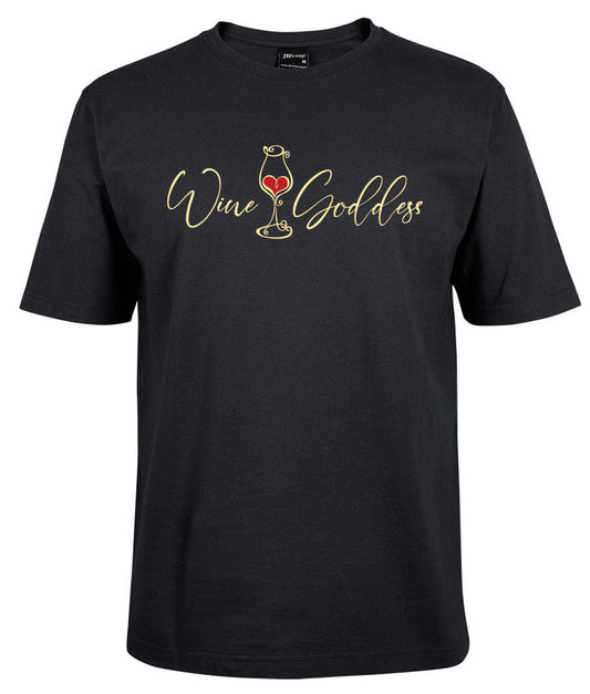 The Wine & Goddess Shirt by Corsa Clothing is a black tee with "Wine Goddess" in gold script, a wine glass forming the letter "i," and a red heart inside the glass.