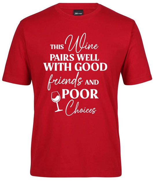 The Pairs Well Good Friends Shirt by Corsa Clothing is a red tee featuring white text—“This wine pairs well with good friends and poor choices”—and includes a small wine glass illustration next to “poor.”.